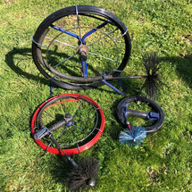 A selection of chimney sweeping reels used to remove fine soot deposits from stainless steel liners.