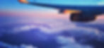 A sunrise seen from a window in a Lufthansa plane