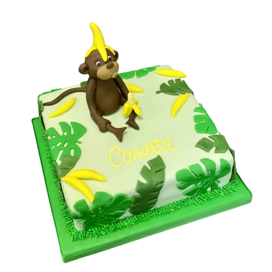 Bespoke Cheeky Monkey cake with playful fondant monkey and jungle leaves, crafted in Solihull, West Midlands.