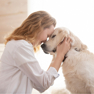 Woman embracing her dog.
