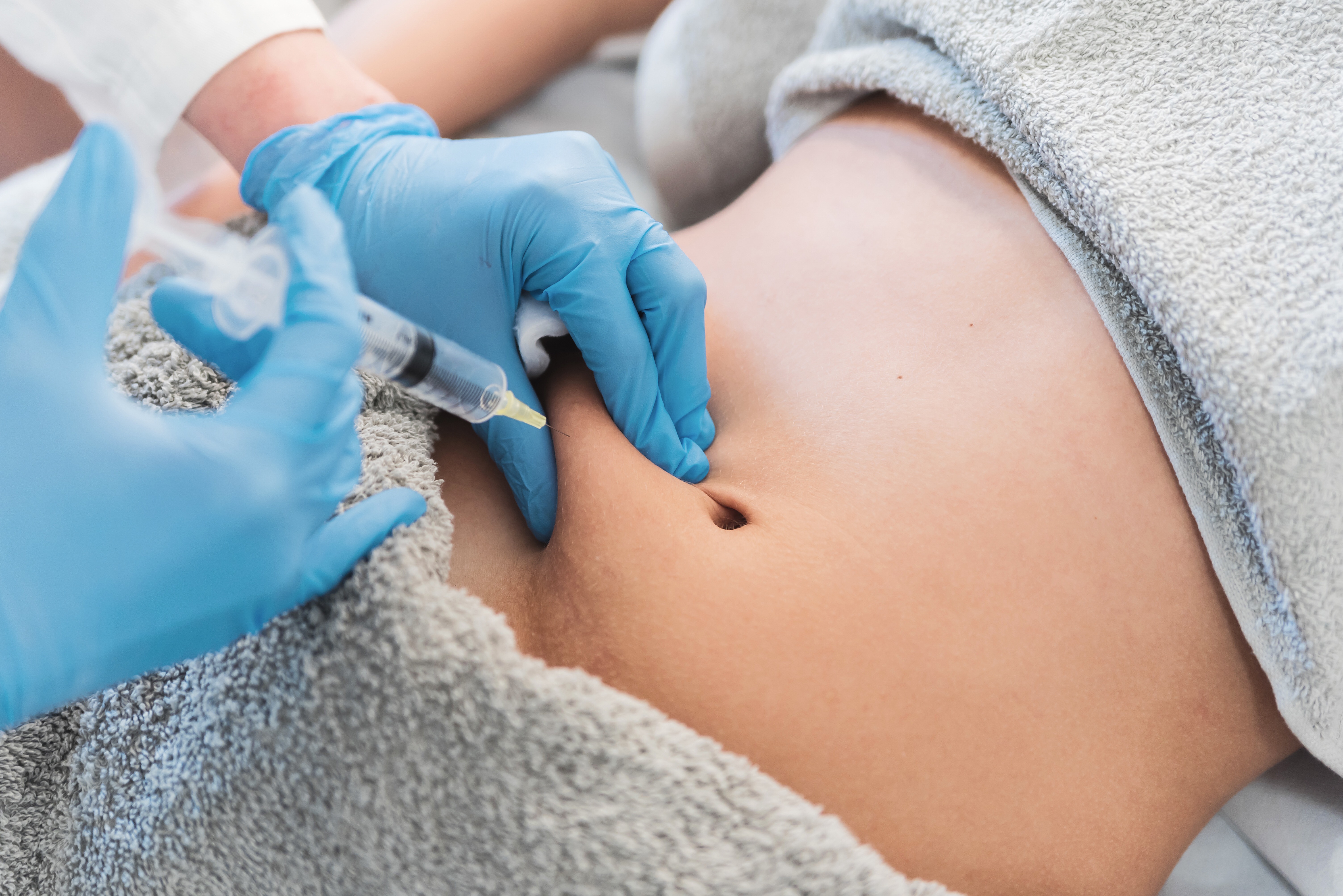 Stock photograph of an abdominal injection treatment