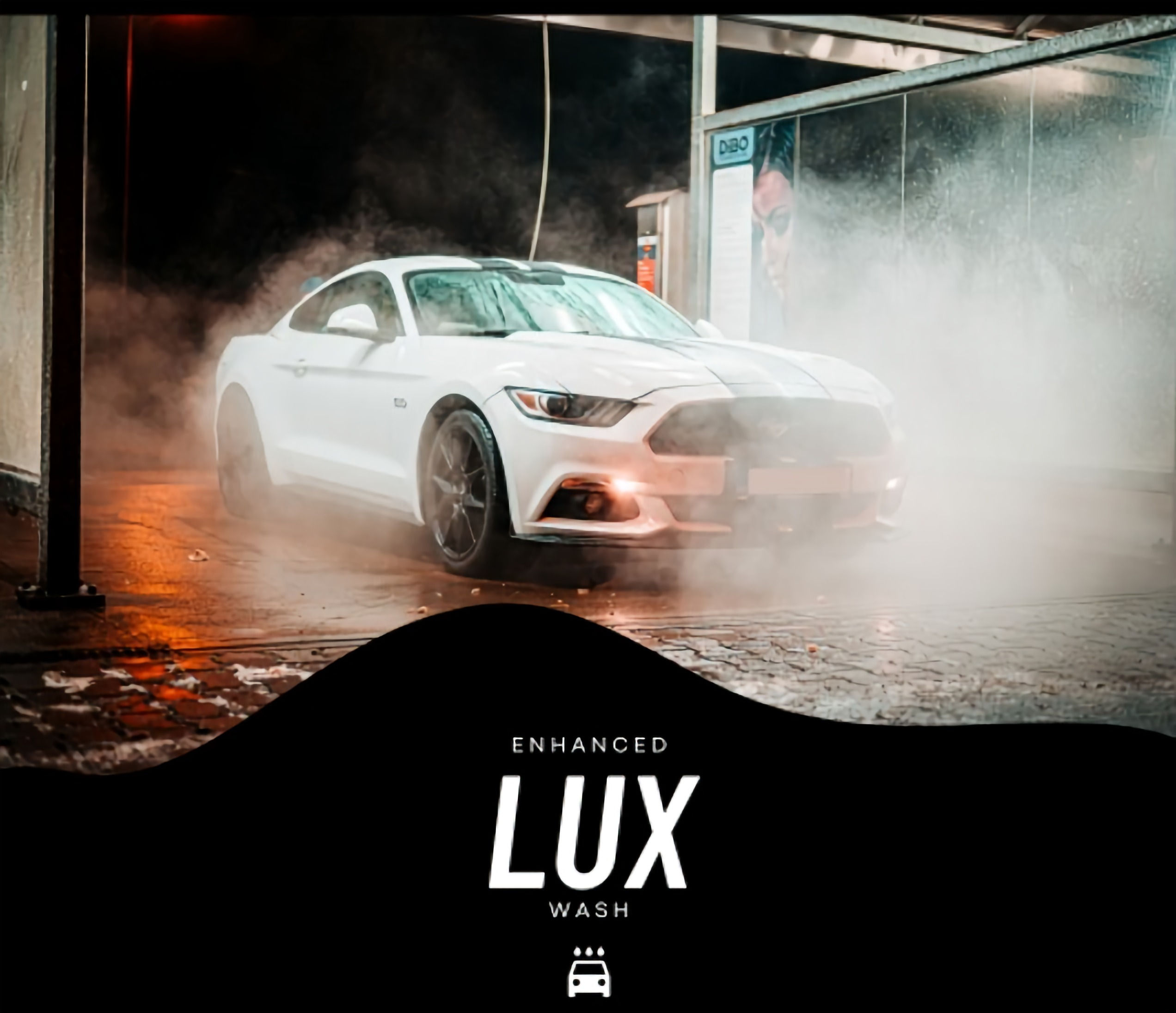 Tesla being cleaned by a lux car wash professional