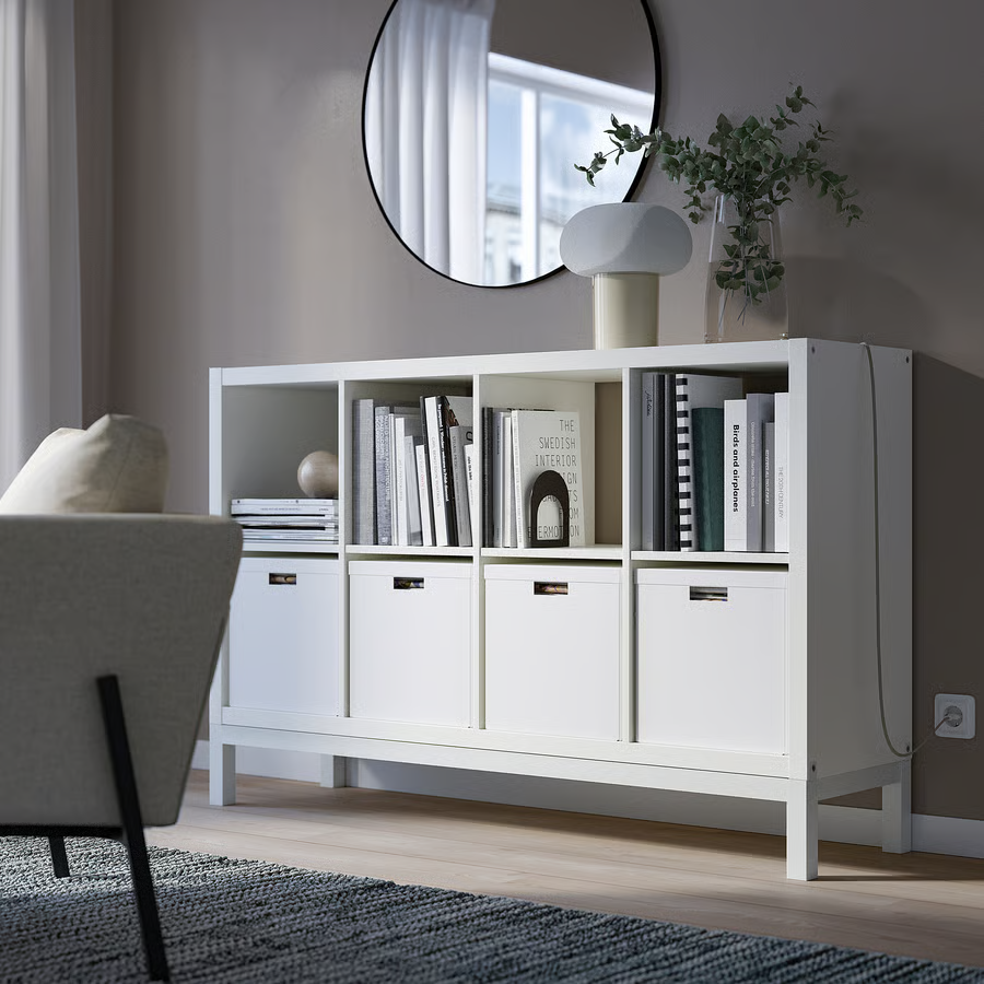 Thumbnail: IKEA Kallax 2x4 white shelf units with white base and legs