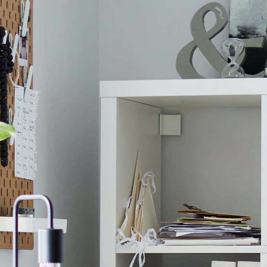 Thumbnail: IKEA Kallax 2x4 white shelf units with white base and legs