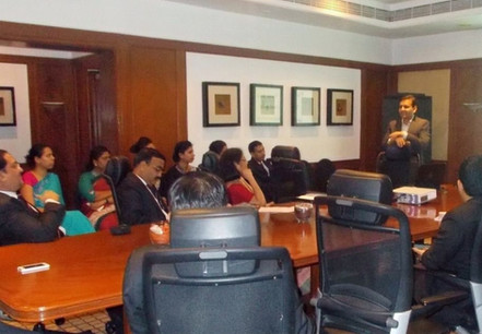 Dr. Vivek Modi presenting to corporate leaders
