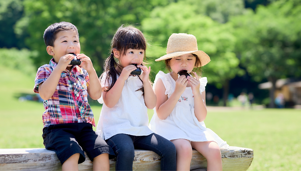 school children enjoying bento box lunches
