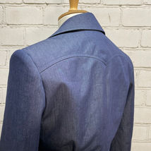 Blue Cotton Suit Jacket with Peaked Yokes and Flap and Pleated Patch Pockets. Built For/Cut By: Marvin Schlichting - Felsen Tailors.  Designed By: Paul Tazewell for "Summer: The Donna Summer Musical".