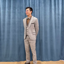 Grey Wool with Herring Bone, Beige Plaid and Coloured Flecks, Grey Leather Lapels and Pocket Welts.