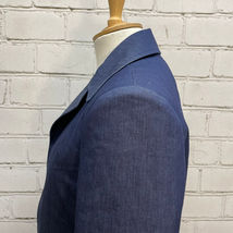 Blue Cotton Suit Jacket with Peaked Yokes and Flap and Pleated Patch Pockets. Built For/Cut By: Marvin Schlichting - Felsen Tailors.  Designed By: Paul Tazewell for "Summer: The Donna Summer Musical".