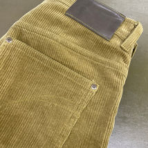 Green Medium Gauge Corduroy Button Fly Jeans with Green Stitching and Gun Metal Hardware.