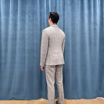 Grey Wool with Herring Bone, Beige Plaid and Coloured Flecks, Grey Leather Lapels and Pocket Welts.