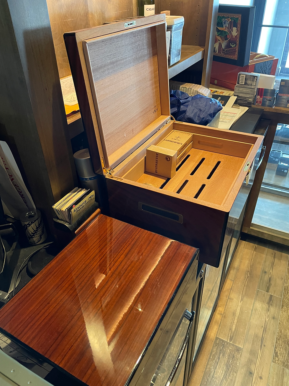 Traditional Wood Humidors displayed on a retail counter