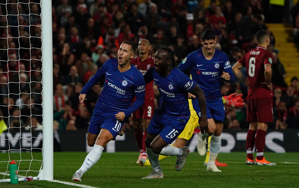 Eden Hazard celebrates his sensational winner at Liverpool tonight Photo Sean Gosling