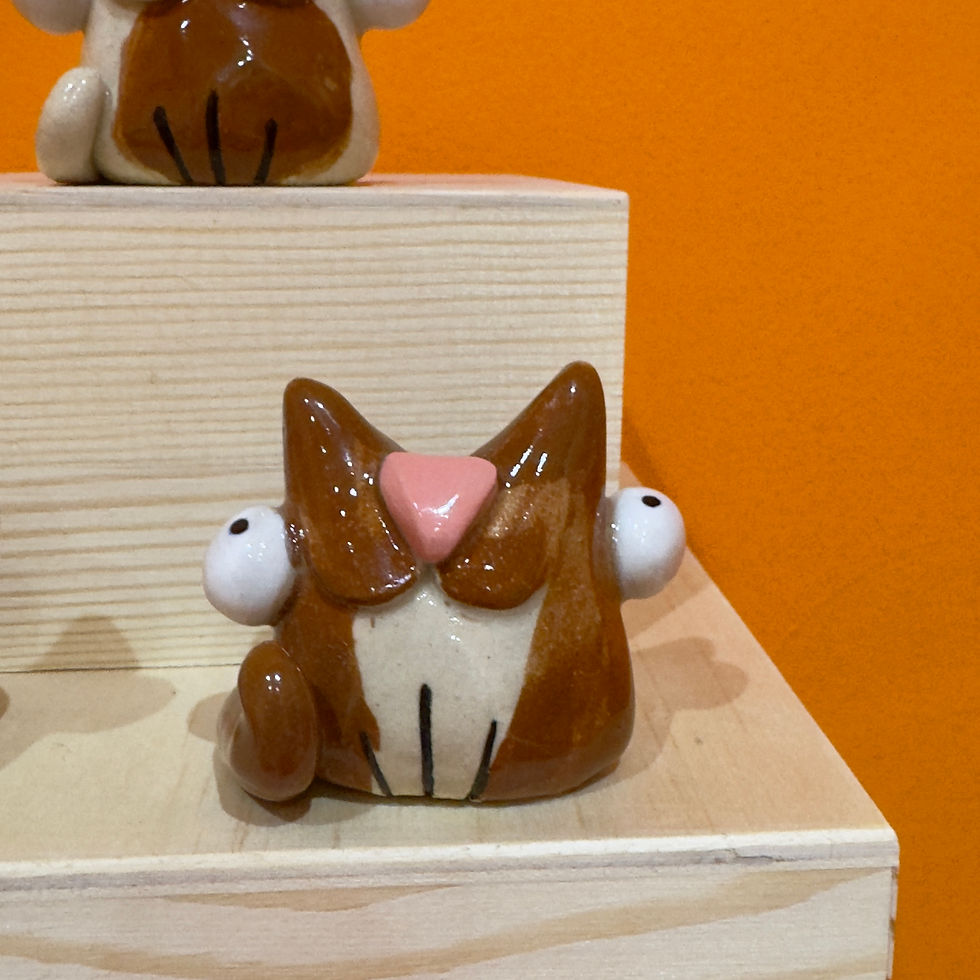 Thumbnail: Silly ceramic cat ornaments