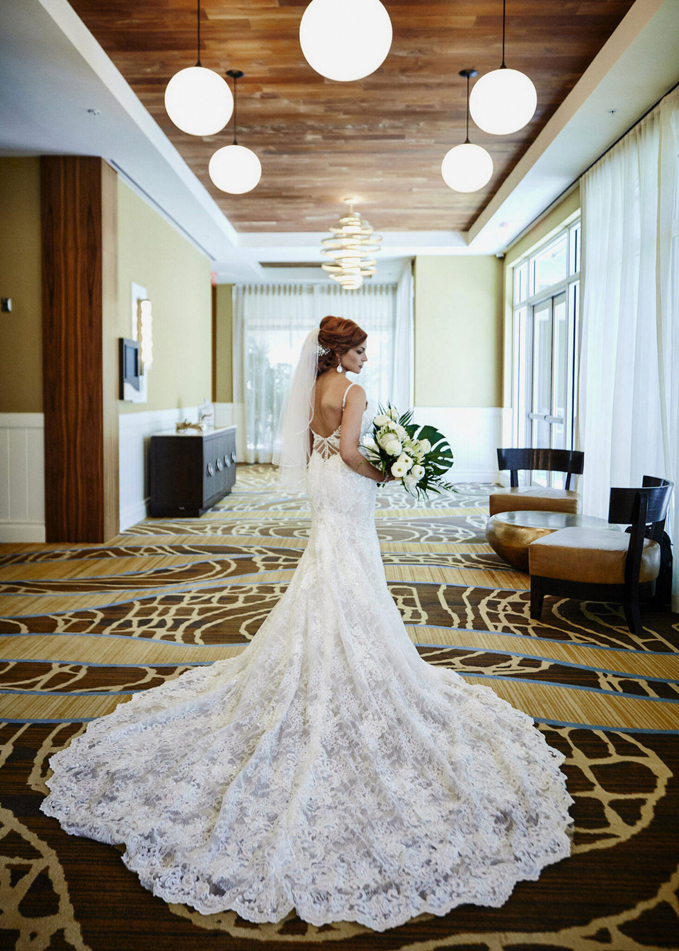 Bride stops at the hotel to showcase her wedding dress.