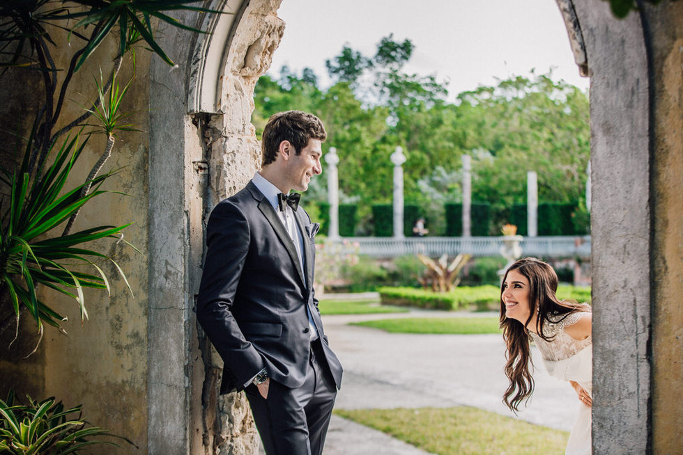 Candid image of bride surprising groom.