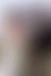 Bride and groom looking at each other with Arizona rocks in the background