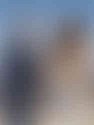 couple play rock paper scissors before their wedding ceremony