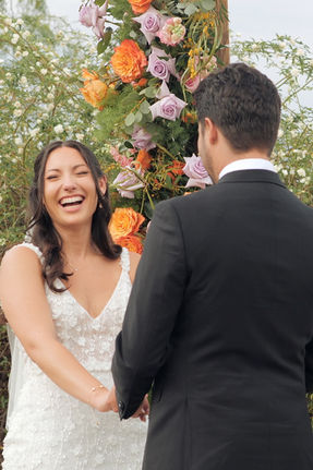 bride and groom share candid moments during their wedding day