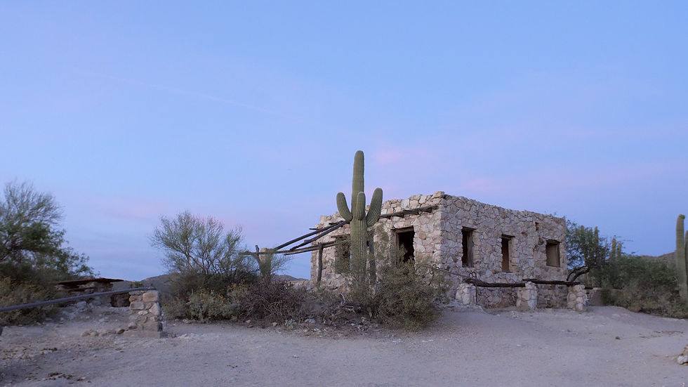The Homestead at Tanque Verde Ranch, a historic stone home at a Tucson wedding venue at sunset