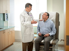 An oncologist talking to a cancer patient