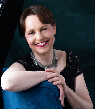 Monika Herzig photo Smiling Center w Keyboard copyright 2025 by Sarah Slover crop.jpg