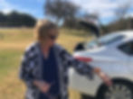 Ellen Groth with a butterfly during a site visit