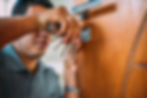 locksmith-opening-door-male-hands-repair-installing-metal-door-lock-with-screwdriver.jpg