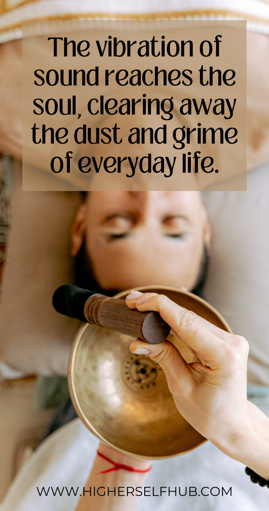 a woman on a massage table with a sound practicioner 