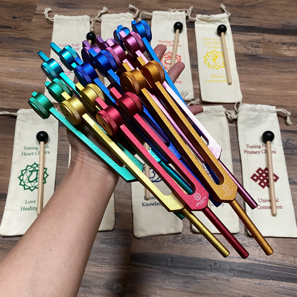set of tuning forks in a rainbow of colors