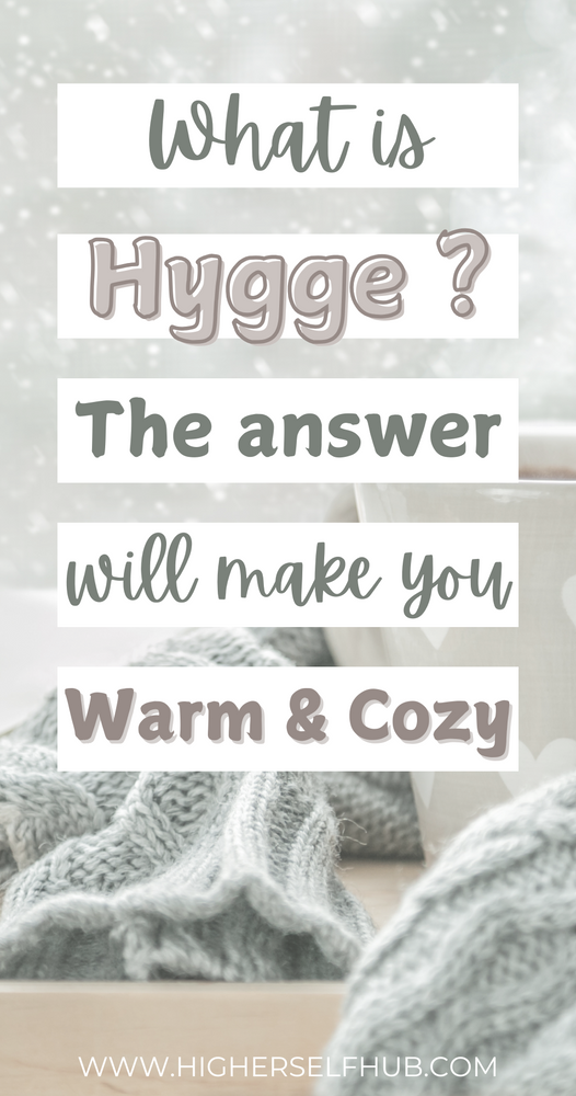 Text graphic asking 'What is Hygge?' with the answer 'The answer will make you Warm & Cozy' overlaid on a soft, wintry background with knit fabric