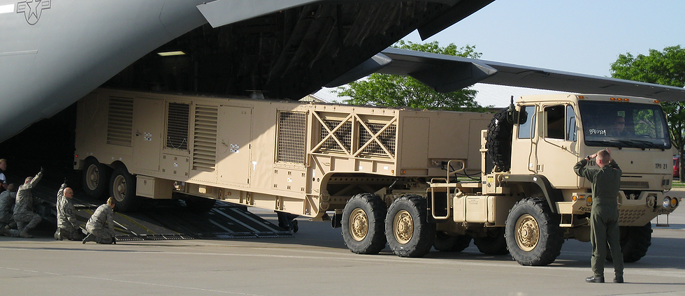 The Prime Power Unit (PPU) for the AN/TPY-2 Radar of the THAAD Missile Defense System is being loaded onto a C-17.