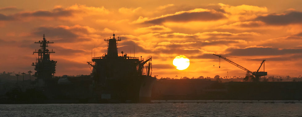 sun sets over San Diego navy base