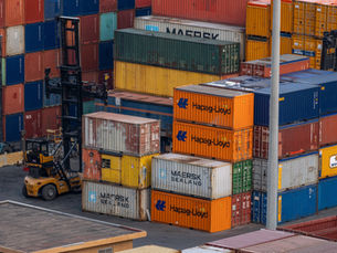 stacked shipping containers on loading dock
