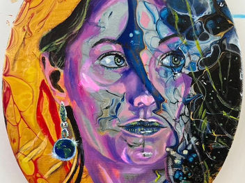 the painting shows a beautiful female face with shades of hot, yellow sun & cool, silver moon.