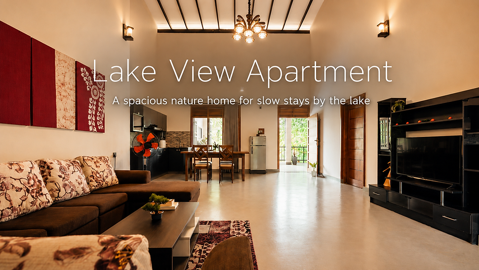 Spacious upper-floor Lake View Apartment with living area, kitchen, dining table and balcony views at NJ House