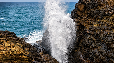 Hummanaya Blow Hole near Kudawella, Sri Lanka, with seawater bursting through the rocky coastline