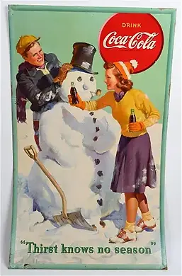 A young man and woman build a snowman while holding a coke in a bottle.