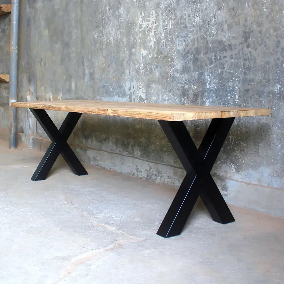 Side profile of industrial teak office desk featuring matte black X-legs and light-finished teak wood slab.