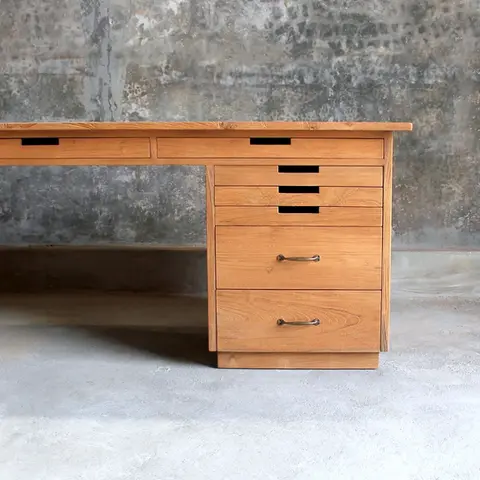 Handmade teak wood double pedestal art desk with multiple drawers and smooth brushed surface, crafted in Jepara for home and studio offices.