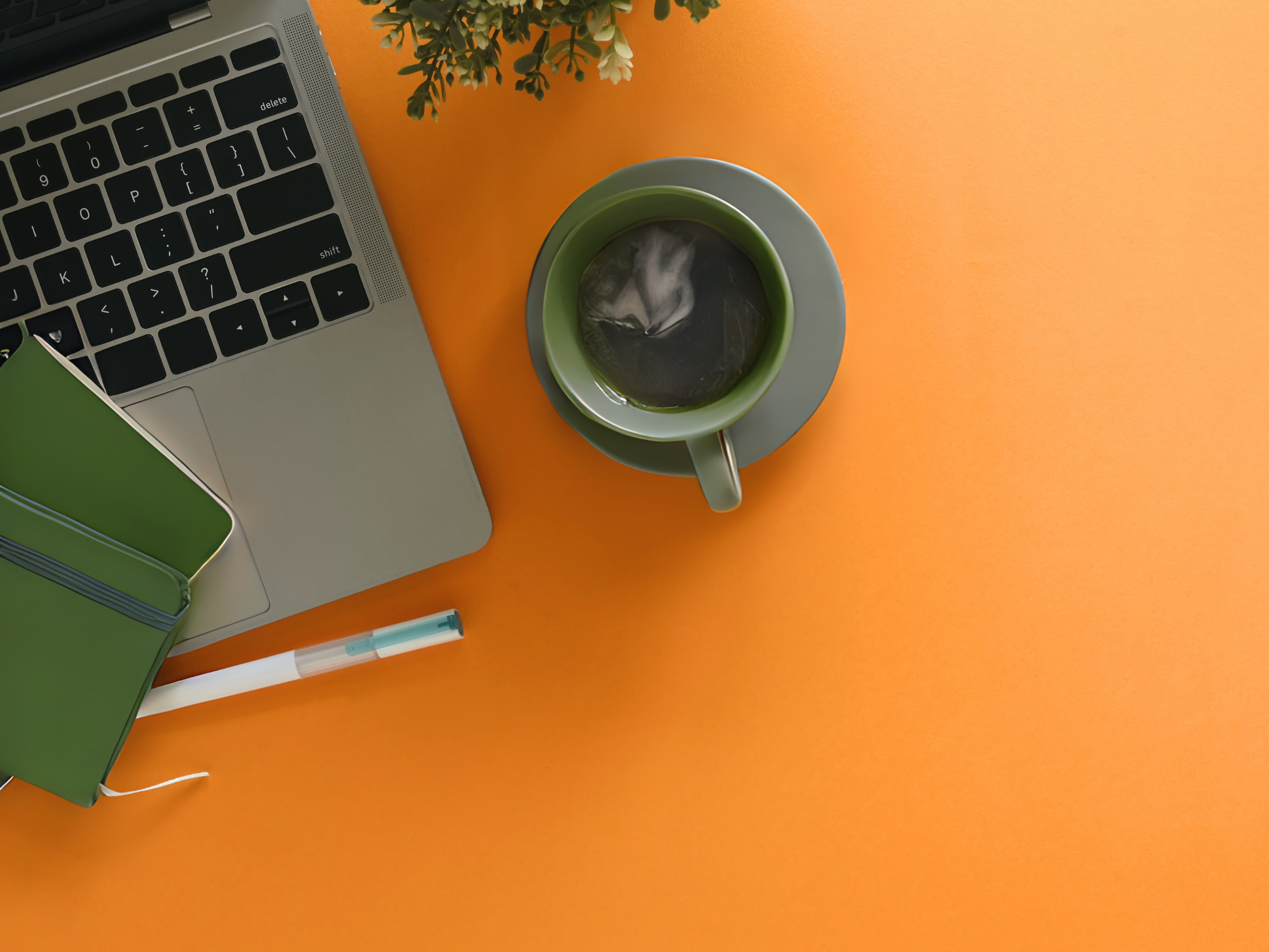 Strategic business consulting workspace with laptop and planner