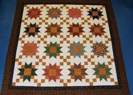 Finished quilt from pattern Stars Over Franklin by Cut Loose Press