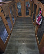 Inside of boarded facilities, showing multiple hutches of various sizes