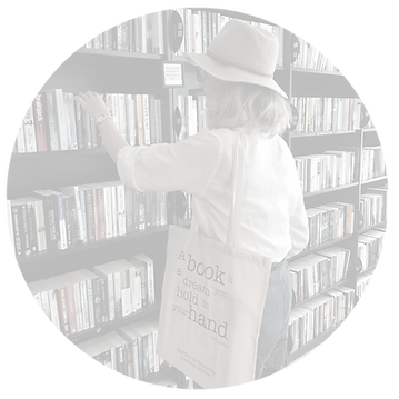 Image of shopper browsing the books available at our bookshop & hearing support centre at No 8 The Old Bookshop in Downham Market