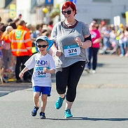 WNDA-Fundraise - One of our child service users and his mum taking part in the GEAR run