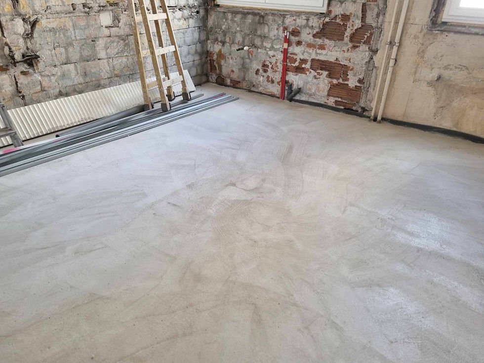 New screed floor beside exposed brickwork, Kossuth Lajos tér apartment renovation