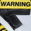 Thumbnail: WARNING - Mini Dress in Black/Yellow with Long Sleeves and Text Applique