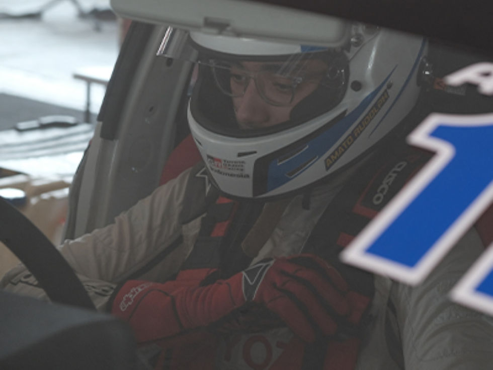 A racing driver seat and prepare before the race starts.