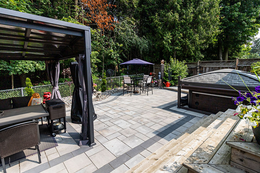 Interlocking patio and outdoor living space installation in Oshawa by Axhorn Landscaping & Contracting.