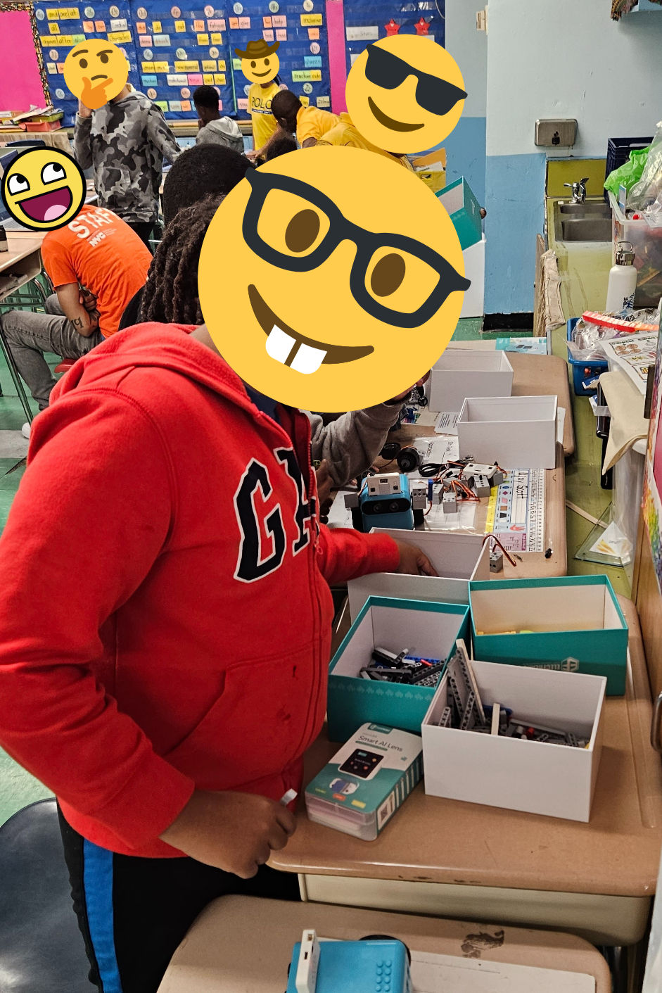 Students looking through bins of Lego bricks to add to their Elecfreaks TPBot and micro:bit STEM activity
